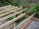 Joists strung out resting on bearers.