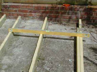 Joists are laid flat to take levels that exist on the concrete base