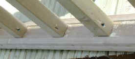 The spindles fixed to top rail of balustrade