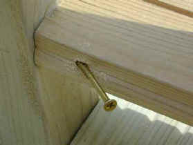 Bottum balustrade rail being fixed to upright newel with pre-drilled holes