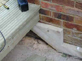 Decking Staircase stringge fixed to house wall