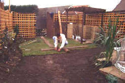Laying the turf from scaffold boards compacts the new turf - and avaids footpring damage